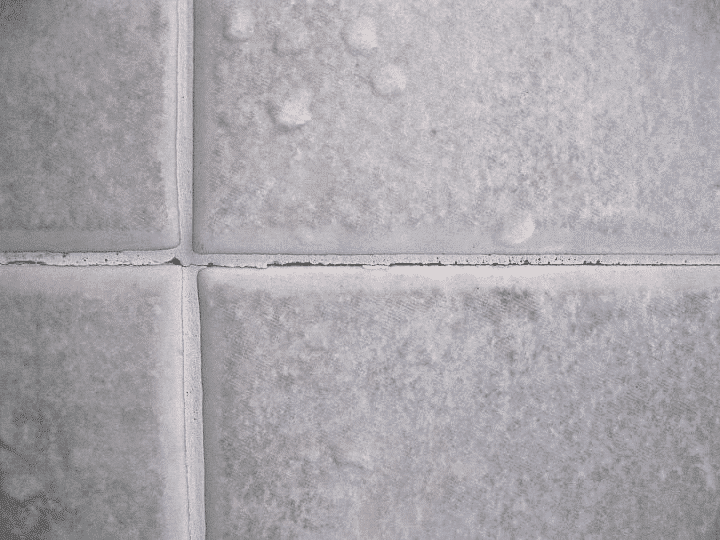 Why does tile grout crack?